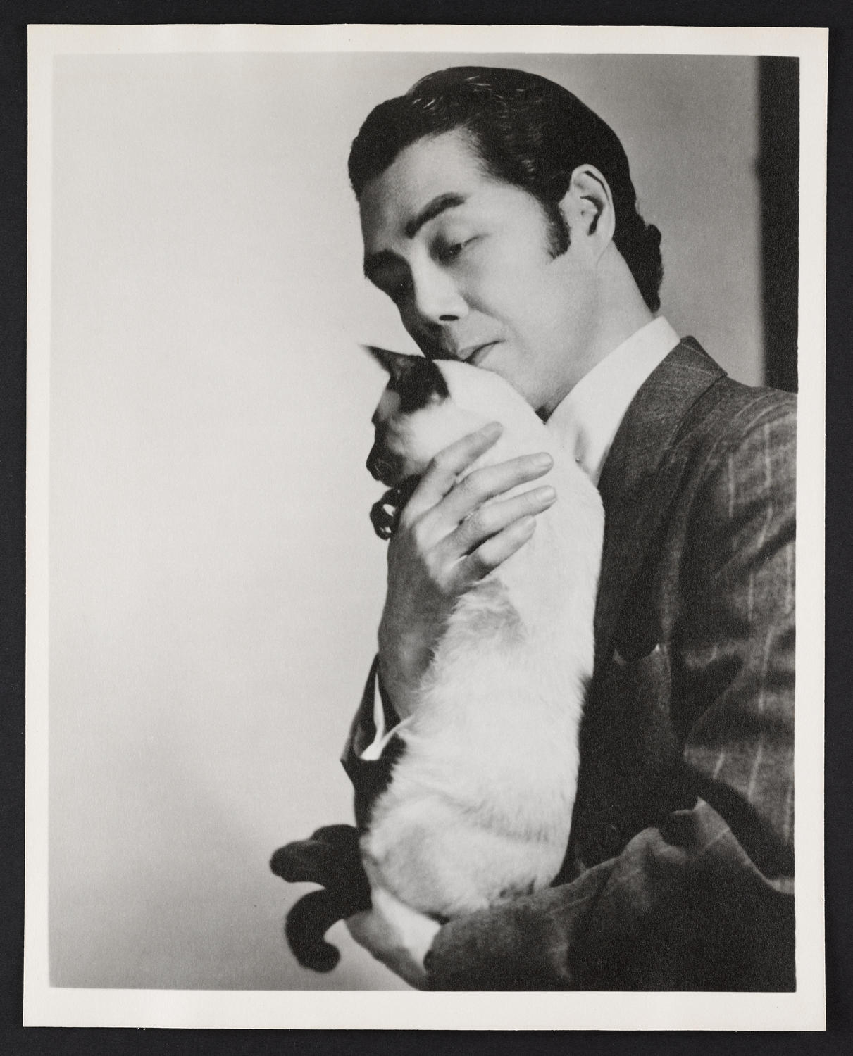 Yeichi Nimura with his cat Ramas, c. 1944