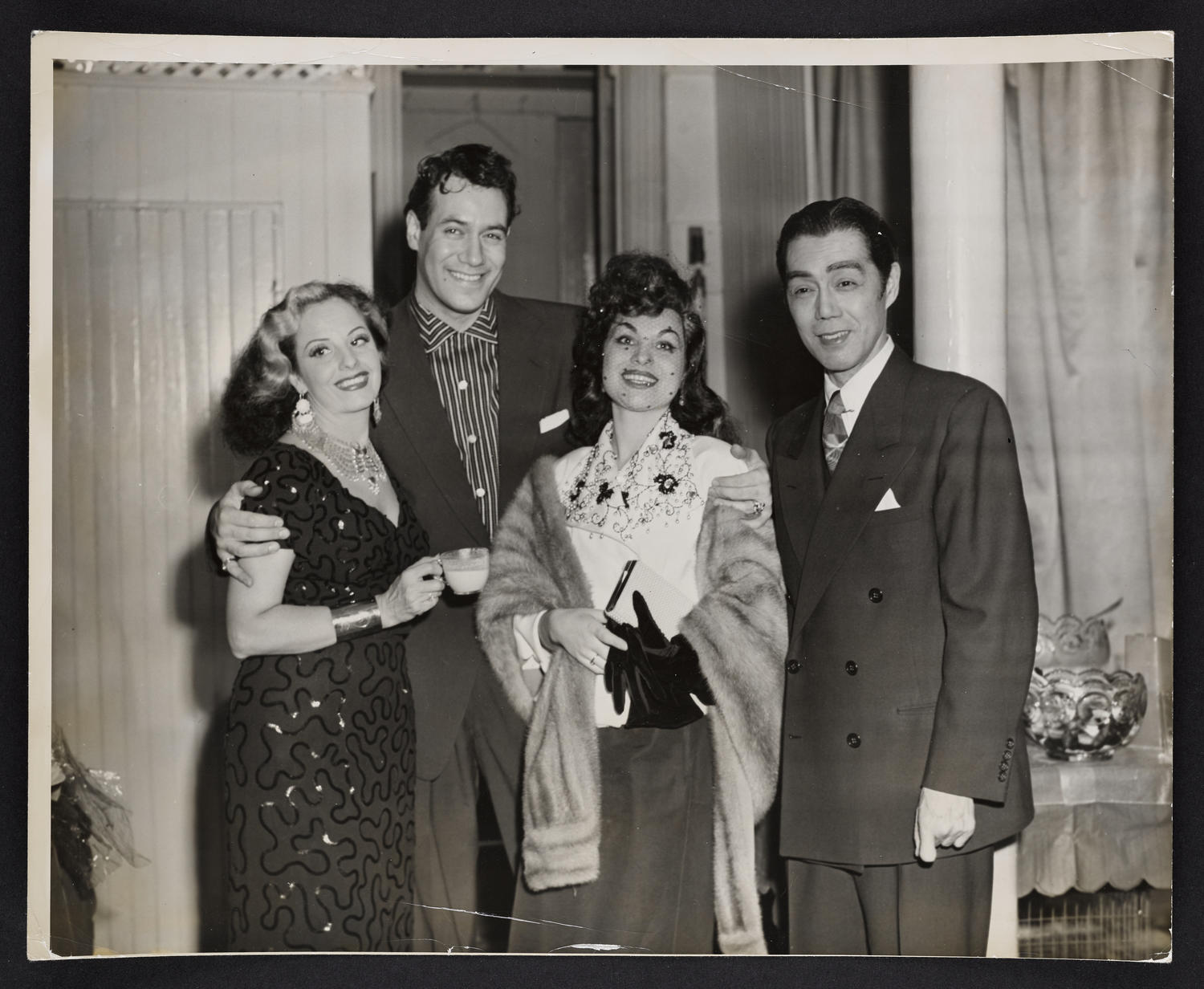 Gypsy Markoff, Valia Valentinoff, Mrs. Valentinoff, and Yeichi Nimura at a New Years' party at Ballet Arts, Carnegie Hall Studio #61, c. 1940s